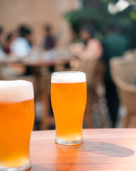 Two Glasses of Beer on a Bar Counter