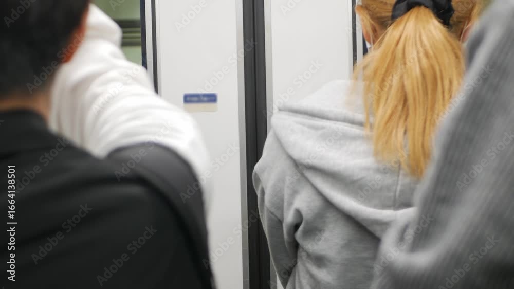 Canvas Prints selective focusing pov to rear back view of passenger while waiting to get out of the train subway c