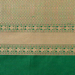 Intricate Green and Gold Banarasi Silk Saree Pattern - Indian Textile