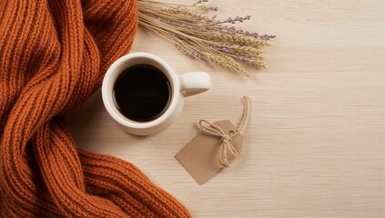 Cozy coffee scene with yellow mug, knit scarf, and pink flowers