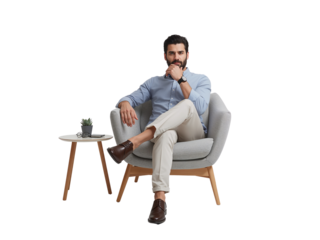 Confident bearded entrepreneur contemplates future plans while seated in a chair on transparent