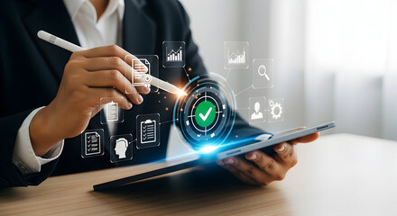 Businesswoman using a tablet with digital interface for project management and approval.