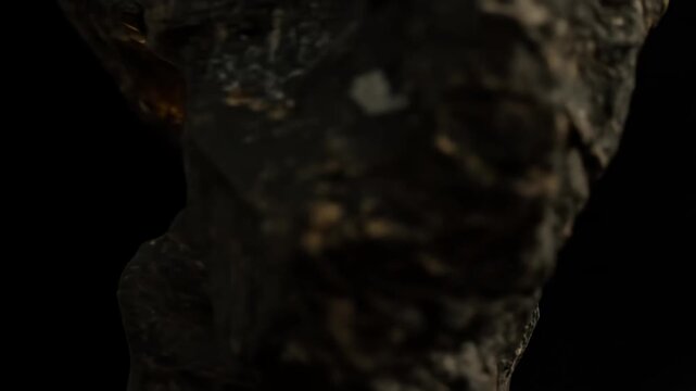 Glowing Golden Crystals Embedded in Ancient Cave Rock