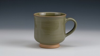 Textured olive green pottery mug with a flared lip on a simple surface