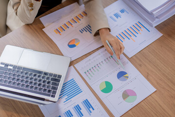 Cluttered office desk stacked with paperwork, tax receipts, and financial documents, symbolizing business stress, accounting, planning, organization, and strategy.

