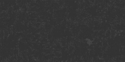 A black background with no visible objects. The background is a solid black color and has a rough texture