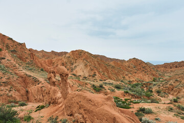 Red sandstone rock formations in Fairy Tale Canyon, Kyrgyzstan