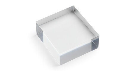 Clear acrylic block sits at an angle on a white surface casting a shadow