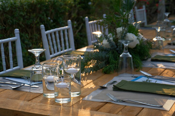 wedding reception dinner table suit set up with decoration flower before evening event start