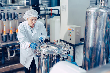 staff work in science medical lab factory check record pressure tank happy working