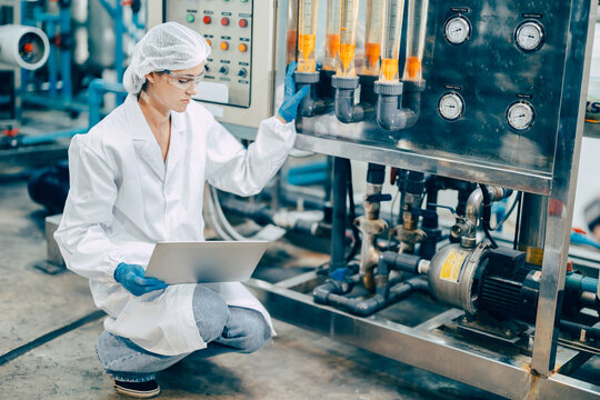 staff hand work in science medical lab factory check record pressure tank with laptop computer