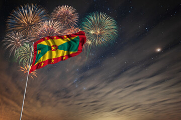 Waving National flag of Grenada and holiday fireworks