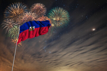 Waving National flag of Haiti and holiday fireworks