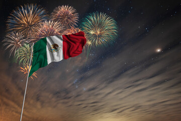 Waving National flag of Mexico and holiday fireworks