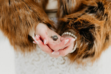 Vintage Ring in Bride&rsquo;s Hands with Fur Coat Detail