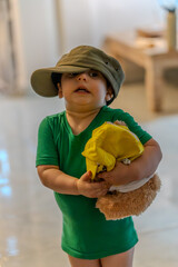 Emerson wearing Dad's hat