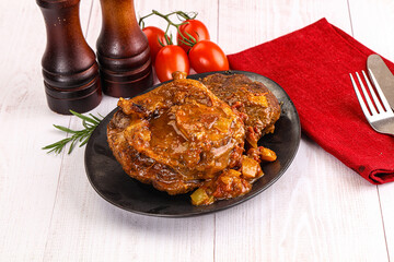 Italian cuisine - ossobuco with sauce
