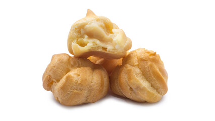 Cream puffs filled with delicious custard are stacked on a white background.
