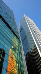 Obraz premium Modern skyscrapers reflecting each other