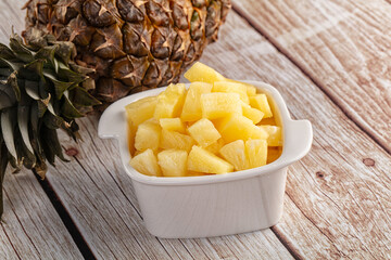 Sweet canned pineapple fruit pieces