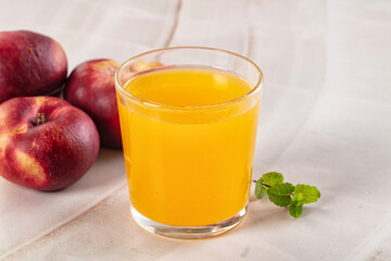 Vitamin beverage - peach juice glass