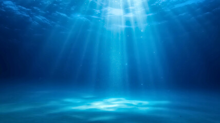 Dazzling underwater light shafts illuminate the pristine blue ocean, creating a serene and mysterious deep-sea environment with sandy bottom reflections