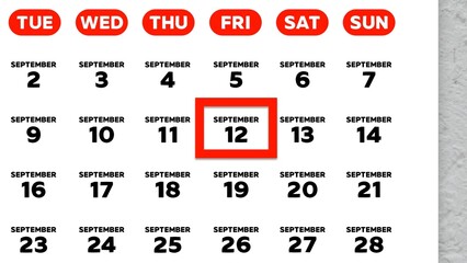 Close-up of the date September 12th marked with a red cursor on the wall calendar 2025