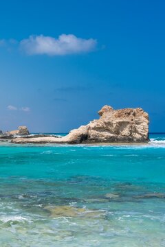 Marsa Matrouh-Egypt Aug 16, 2025: Rocks and waves located in Cleopatra Bath, Marsa Matrouh. in the North coast of Egypt