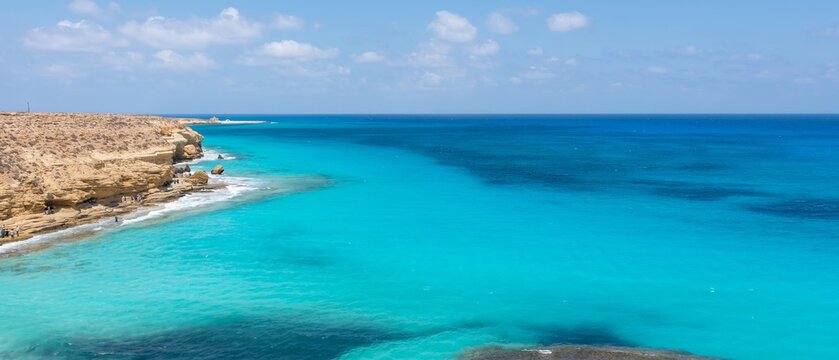 Marsa Matruh-Egypt Aug 16, 2025: Panorama of a Beautiful natural scenery of Ageeba Beach in marsa matrouh Egypt during daytime, Sea Shore in Sunny Day. in the North coast of Egypt