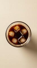 Overhead view of iced coffee in a clear glass