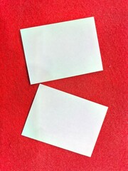 Blank White Papers on Red Background