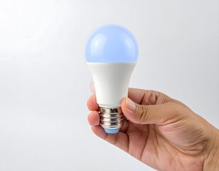 Hand Holding Glowing Light Bulb: Idea and Innovation