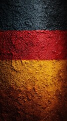 Vivid texture of a weathered wall showcasing the colors of the German flag