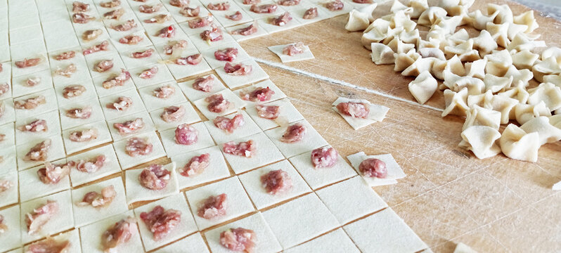 manti ( turkish ravioli type dumplings )served with garlic yoghurt, melted aleppo pepper butter and dry mint and sumac