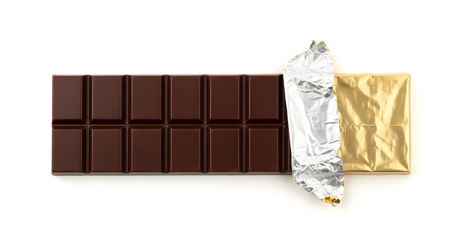 A dark chocolate bar, partially unwrapped from its shiny gold and silver foil packaging, presented against a clean white background.