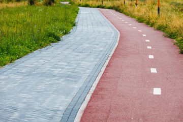 Walking and cycling paths run along the edge of the city park