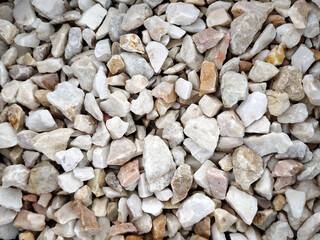 Small stones, rock material, various colors for use in the garden and construction.
