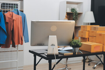 Portrait of Starting small businesses SME owners, two Asian woman check online orders Selling products working with boxs freelance work at home office, sme business online small medium enterprise