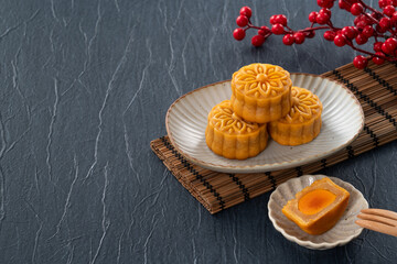Cantonese moon cake for Mid-Autumn Festival food mooncake on blue table background.
