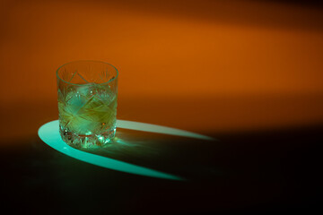  Icy Whiskey Glass with Caustic Patterns Under Blue Light