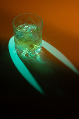  Icy Whiskey Glass with Caustic Patterns Under Blue Light