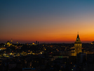 Obraz premium Iconic Galata Tower in the Sunset Lights Drone Photo, Galata Beyoglu, Istanbul Turkiye (Turkey)