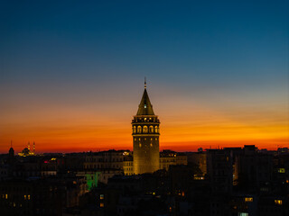 Fototapeta premium Iconic Galata Tower in the Sunset Lights Drone Photo, Galata Beyoglu, Istanbul Turkiye (Turkey)