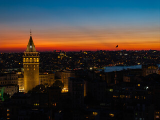 Obraz premium Iconic Galata Tower in the Sunset Lights Drone Photo, Galata Beyoglu, Istanbul Turkiye (Turkey)
