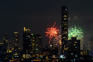 Blurred background of night lights in Bangkok. Fireworks, traffic lights, lights on bridges over...