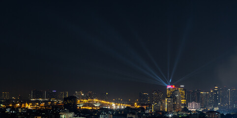 Blurred background of night lights in Bangkok. Fireworks, traffic lights, lights on bridges over...