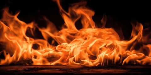 Fototapeta premium The Flames Dancing Across a Dark Background Creating Intense Orange and Yellow Movement