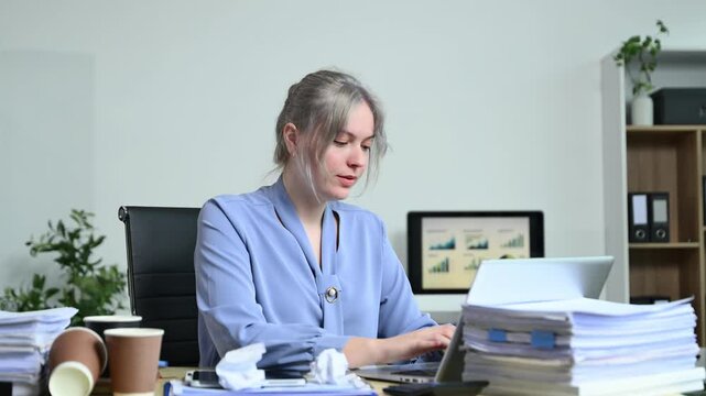 Overworked Businesswoman Under Stress Office Burnout, Paperwork Pressure, Deadlines, and Mental Health Challenges in a Busy Workplace Environment