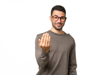 Young handsome caucasian man over isolated background inviting to come with hand. Happy that you came