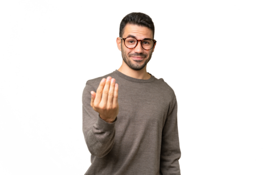 Young handsome caucasian man over isolated background inviting to come with hand. Happy that you came